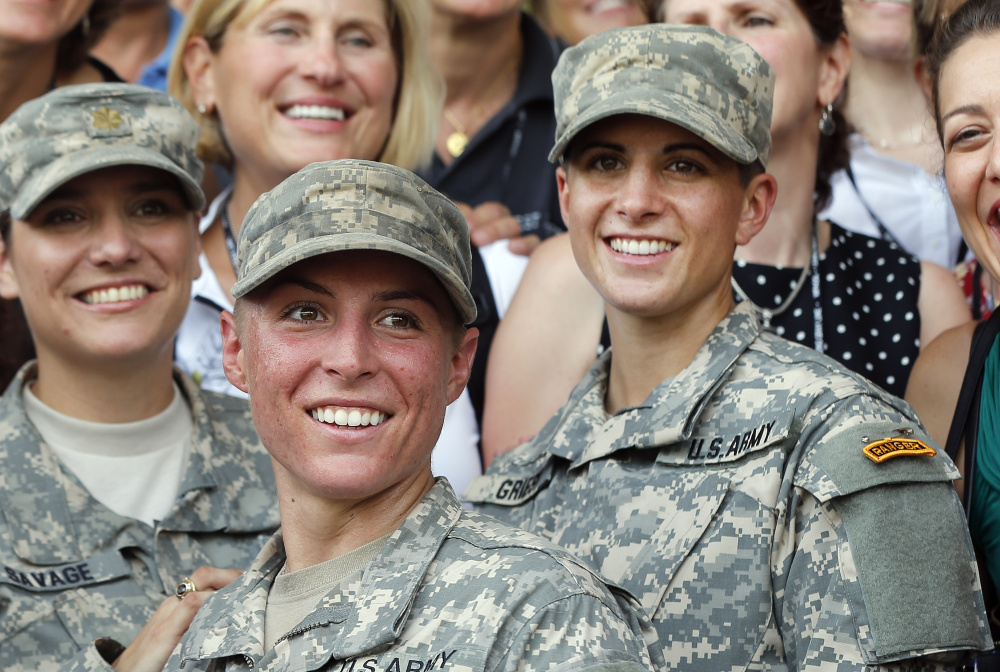 Lt. Shaye Haver, center, and Capt. Kristen Griest, right, are all smiles after completing Ranger School in August.
