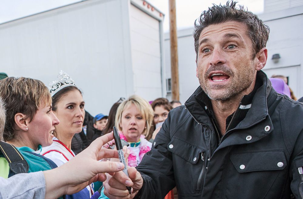 Patrick Dempsey signs autographs before the start of the walking challenges during The Patrick Dempsey Center for Cancer Hope & Healing fundraiser on Saturday in Lewiston. On Sunday, Dempsey will participate in a 50-mile bike ride.