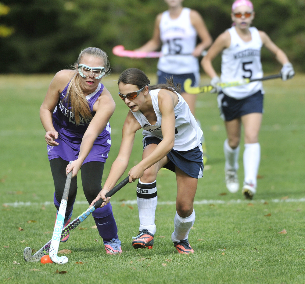 Kayla Thoits, left, of Deering, tries to slow down Westbrook’s Abby St. Clair. Westbrook, the No. 8 seed in Class A South, will play top-ranked Cheverus in the quarterfinals on Tuesday.
