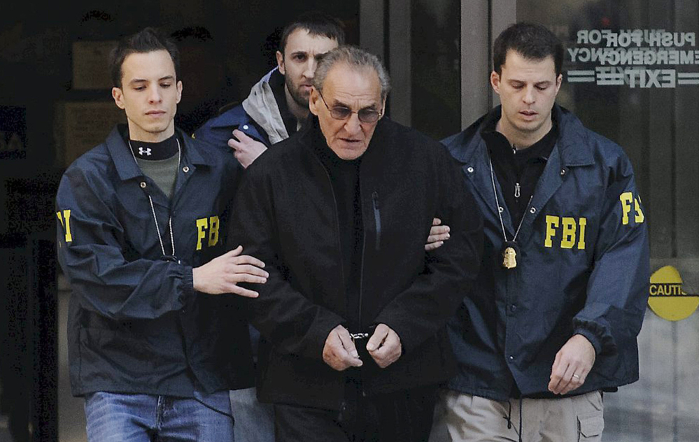 Agents escort reputed mobster Vincent Asaro from FBI offices in New York on Jan. 23, 2014. The now 80-year-old will stand trial for helping to plan the 1978 heist that became immortalized in the Martin Scorsese mob movie “Goodfellas.”