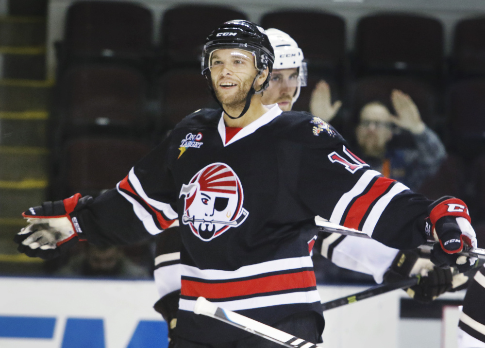 Rob Schremp of the Portland Pirates celebrates after his second goal of the game Sunday in a 5-2 win over the Hershey Bears at Cross Insurance Arena.