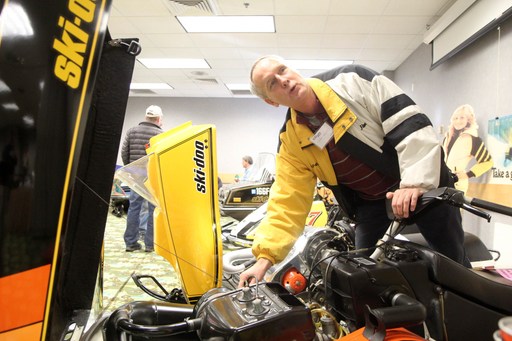 Jim Dunphy of Pittsfield talks about his 1979 Ski-Doo Blizzard at the Maine Snowmobile Show at the Augusta Civic Center on Sunday.