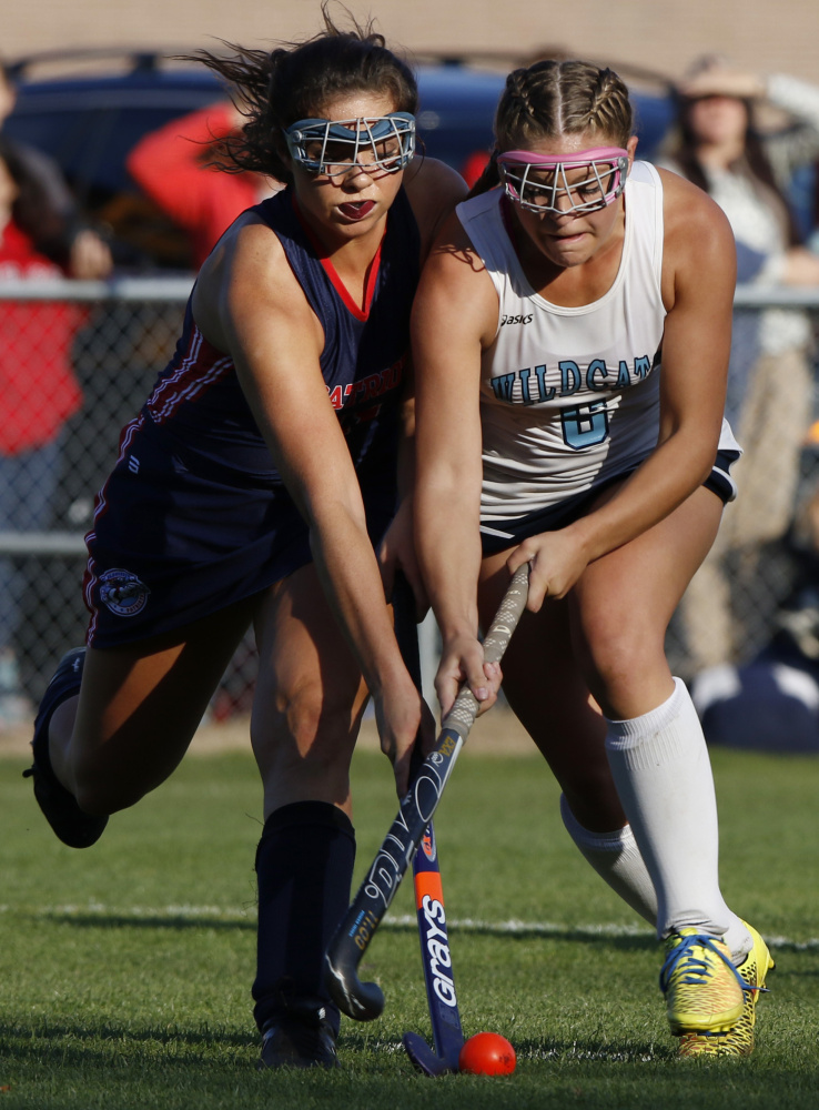 Alicia Dumont of Gray-New Gloucester, left, competes for the field hockey ball with Alie Jones of York during the first half of York’s 7-1 victory Tuesday in a Class B South quarterfinal.