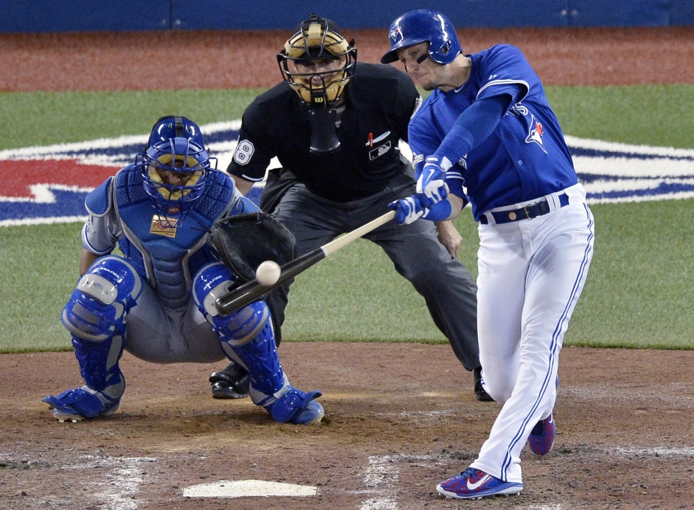 Toronto’s Troy Tulowitzki hits a three-run double to break the game open in the sixth inning. The Blue Jays scored four runs in the inning to take a 5-0 lead.