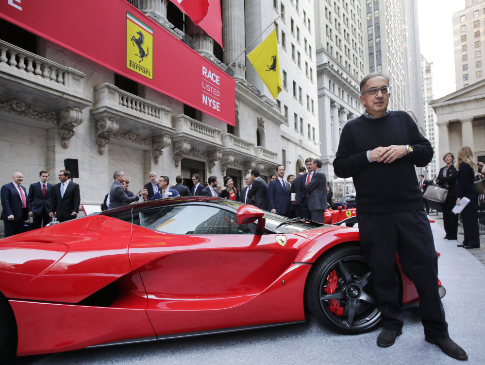 Fiat Chrysler CEO Sergio Marchionne stands with a La Ferrari in front of the New York Stock Exchange in advance of the automaker’s IPO Wednesday.