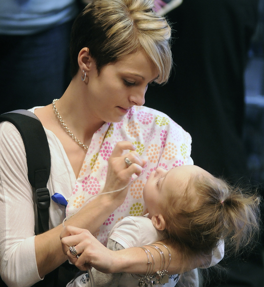 Jamie Davis, of New Sharon, clears the mouth of her daughter, Addilyn, before attending a hearing in April on a bill that would have put screening for Krabbe disease and similar disorders on the list of what’s tested for in newborns in the state. Addilyn died Wednesday morning.