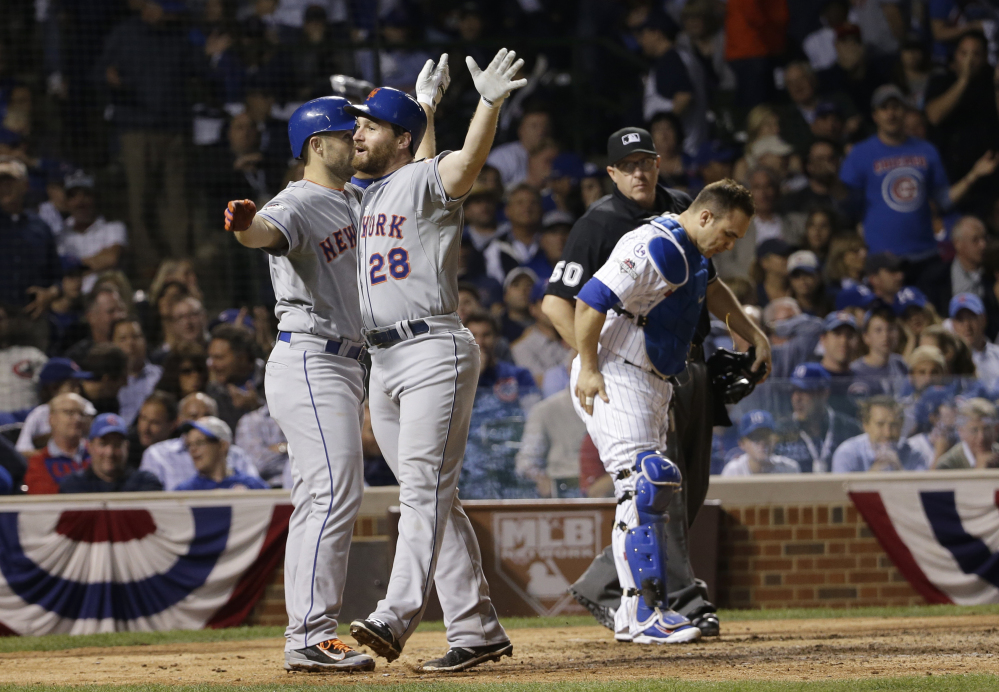 Murphy celebrates with teammate David Wright after hitting a two-run home run in the eighth inning that gave the Mets an insurmountable 8-1 lead.