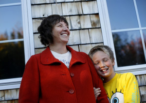 Florence Reed with her son at their nearly net-zero home in Surry. Friends first “lured” Reed and her husband, Bruce Maanum, to the area, and “we also really appreciated the environmental ethic that was so prevalent here, and all that was going on in regards to sustainable organic farming.”