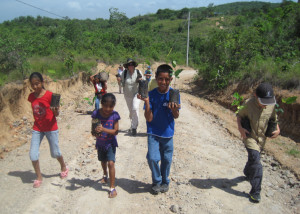 Reed with a crew of children on the way to plant trees in Tranquilla, Panama.