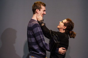 Betsy Aidem, as Marguerite Oswald in “Mama’s Boy,” embraces Graham Emmons, as Lee Harvey Oswald, during a rehearsal for “Mama’s Boy” at the St. Lawrence Arts Center in Portland.