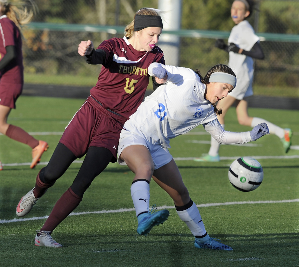 Tyler Spence of Falmouth attempts to keep the ball from Cassidy Cochrane of Thornton Academy. Thornton earned a berth against Gorham in the quarterfinals Tuesday.