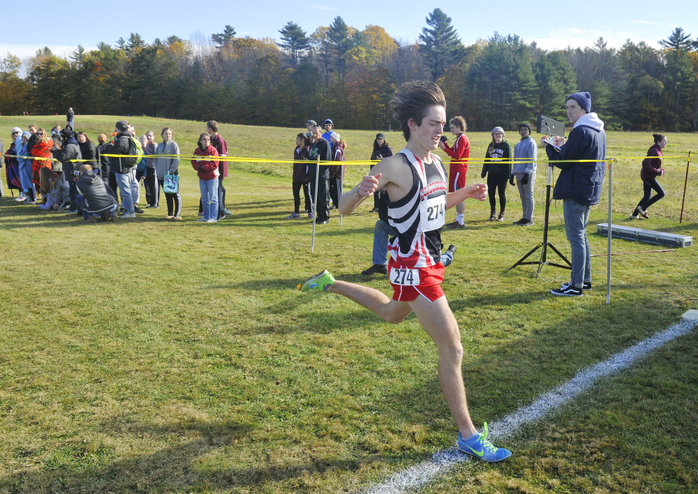 John Ewing/Staff Photographer Scarborough’s Colin Tardiff wins the Class A South cross country regional on Saturday at the Twin Brook Recreation Area on Saturday. Tardiff won in 16:39.54.