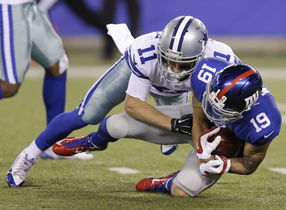 Myles White of the Giants recovers a fumble by Cole Beasley of the Cowboys on a punt return in the second half Sunday in East Rutherford, New Jersey. The Giants won, 27-20.