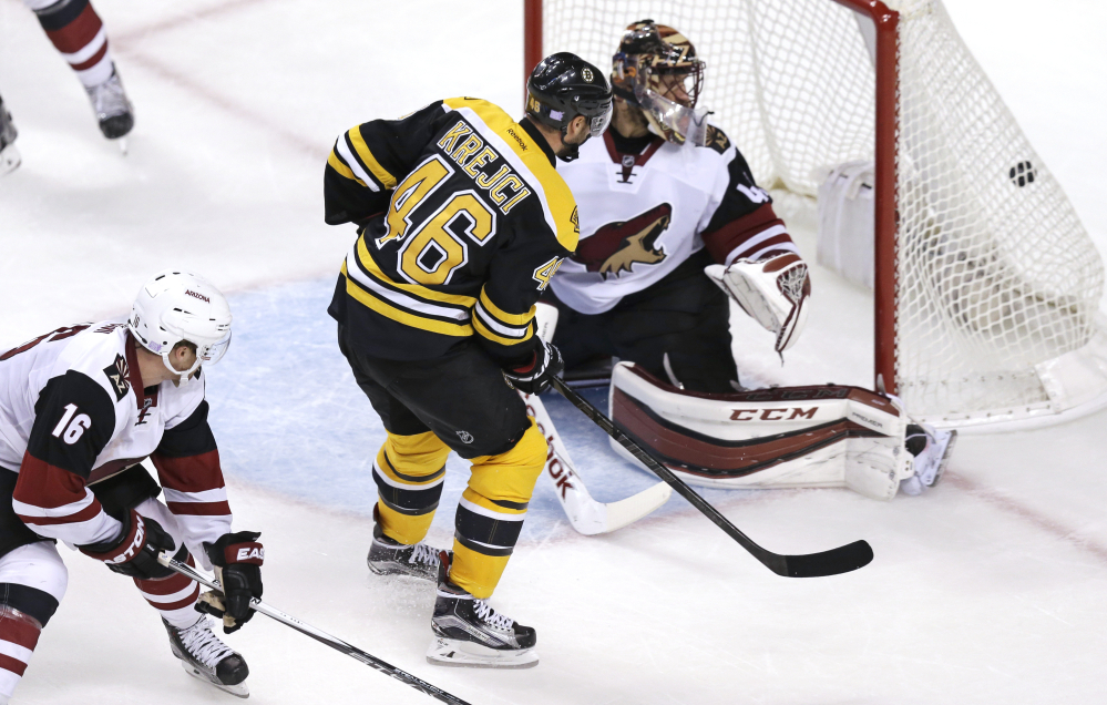 Bruins center David Krejci beats Arizona Coyotes goalie Mike Smith in the third period for his second goal of the game.