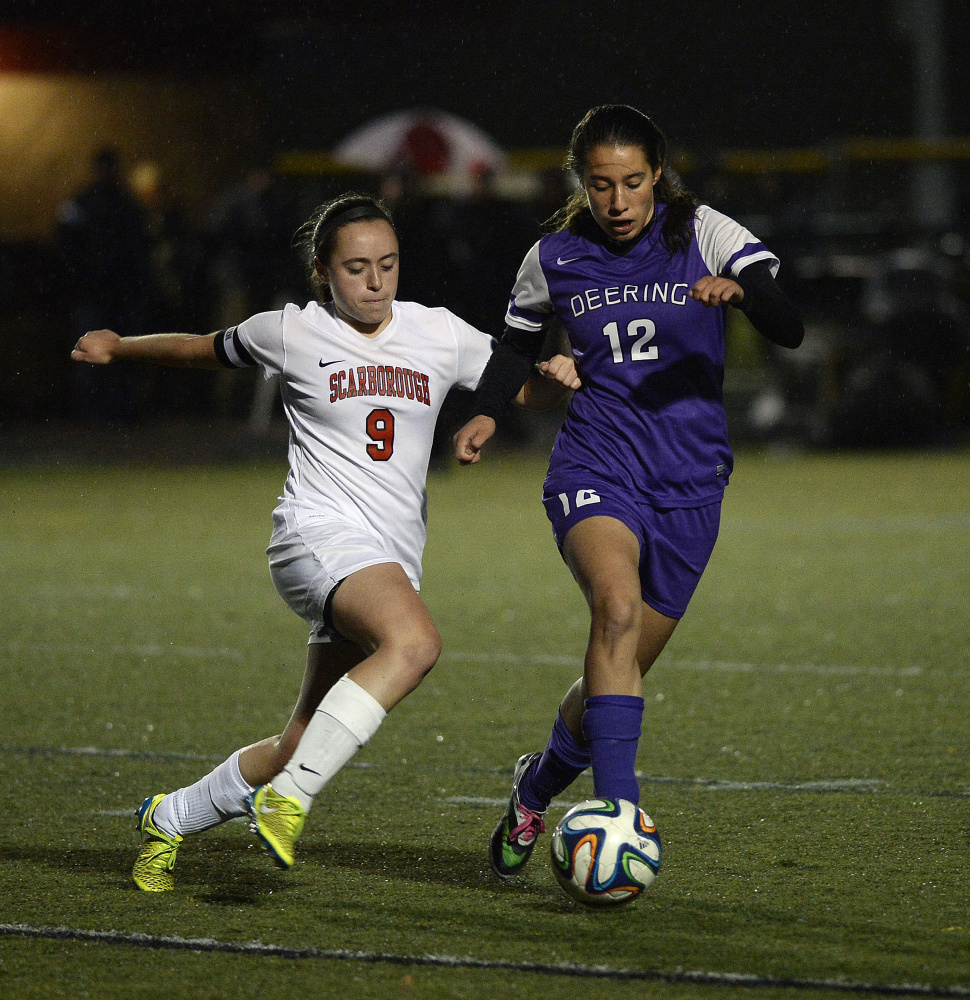Scarborough's Mary Farnkoff and Deering's Meghana Clere battle for the ball in girls' soccer playoff action. Shawn Patrick Ouellette/Staff Photographer