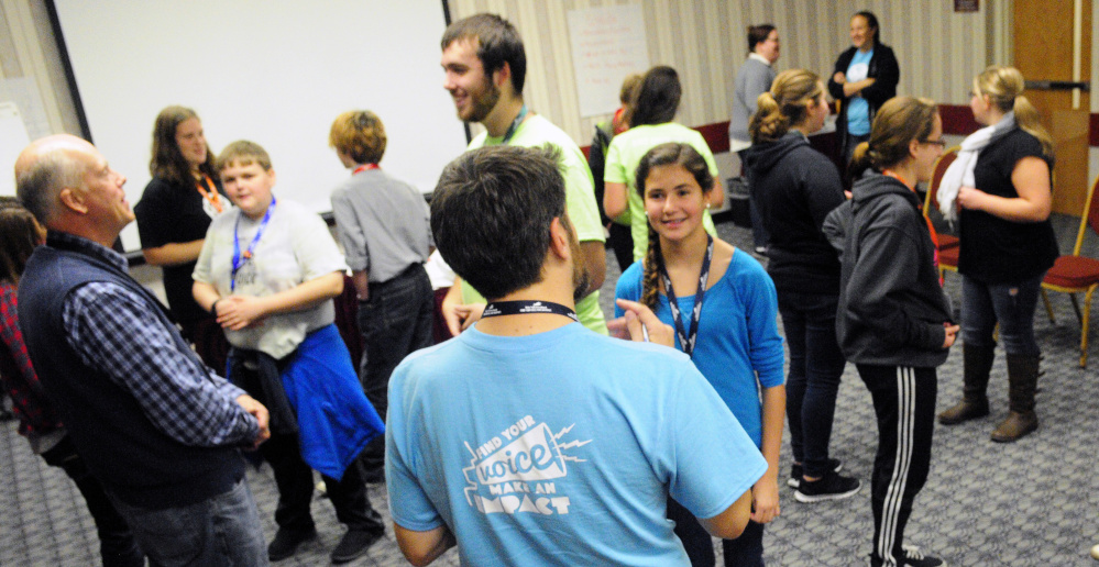 People talk in pairs as part of a session of the Maine Youth Action Network event on Thursday at the Augusta Civic Center.