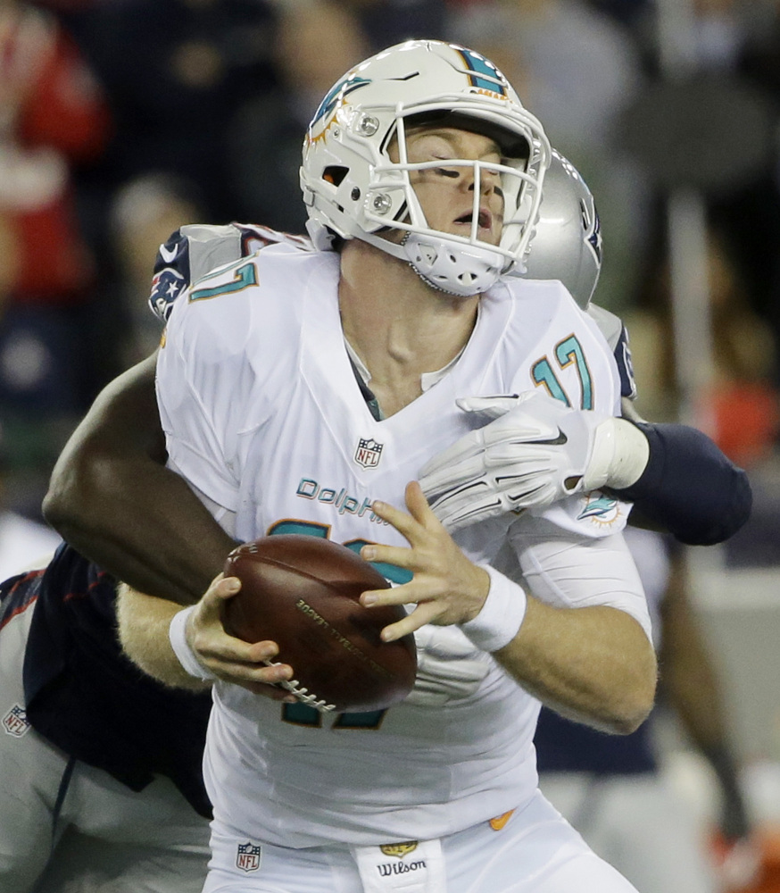 The Patriots defense, including Chandler Jones (95), made it a tough night for Dolphins quarterback Ryan Tannehill.