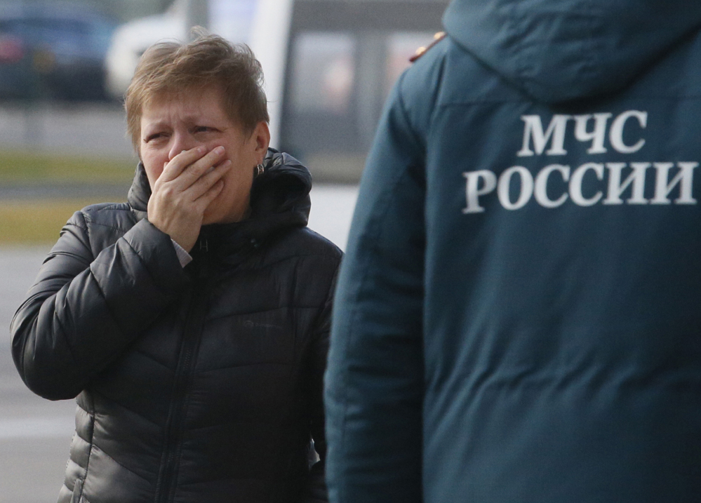 A relative of the victims of a Russian airliner crash reacts at Pulkovo airport in St.Petersburg, Russia, on Saturday.