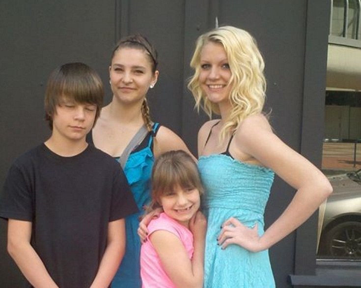 Morgan Brittain, right, poses with her brother, cousin and younger sister on the day before she overdosed in May 2013.