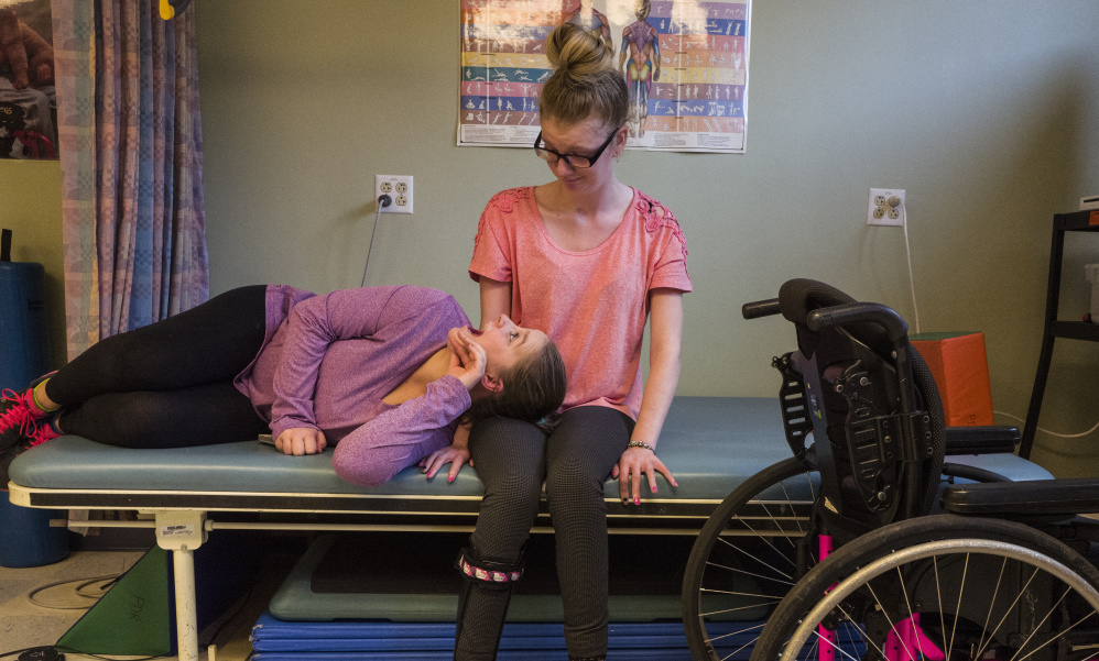 Morgan Brittain, 19, right, awaits a physical therapy session with her cousin Hannah Terry, 16, in Portland, Oregon, on October 6. Brittain is slowly recovering from a heroin overdose that she suffered more than two years ago.