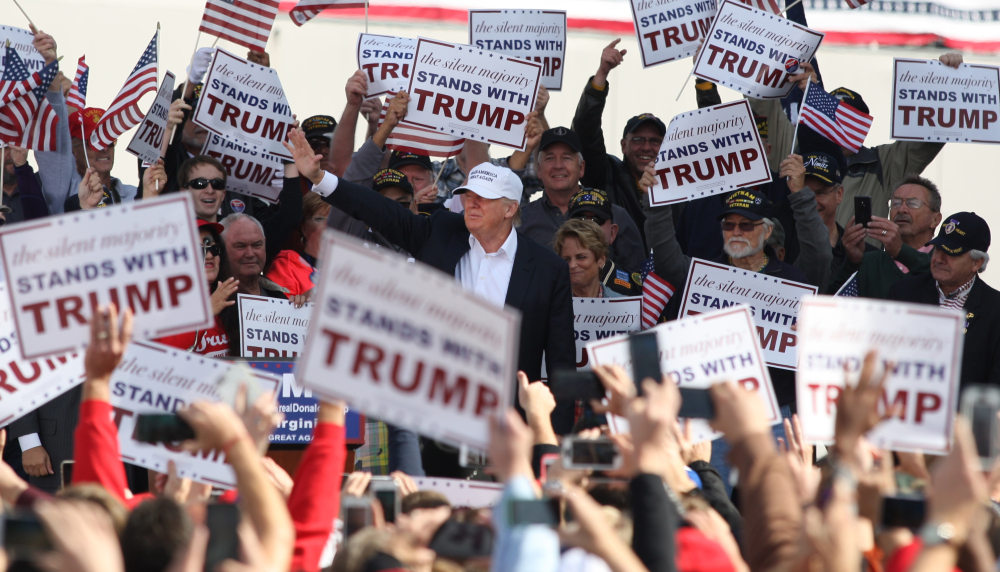 Donald Trump shows he can walk with – not above – his supporters at a Saturday rally in Norfolk, Va., where he draws the kind of enthusiastic crowd that make other Republican presidential candidates envious.