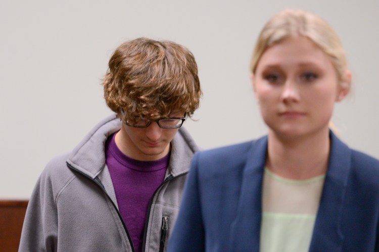 Christopher Leonard appears in court Wednesday to testify against his half sister, Sarah Ferguson, in New Hartford, N.Y. Ferguson is accused of second-degree assault for allegedly beating the 17-year-old during an attack at church. The woman at his right was not identified.