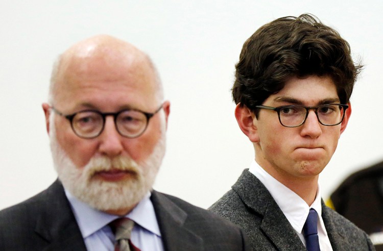 Owen Labrie, right, listens to prosecutors with his lawyer J.W. Carney, before being sentenced in Merrimack County Superior Court Thursday in Concord, N.H. Labrie was allowed to remain free on bail while he appeals his conviction. The Associated Press