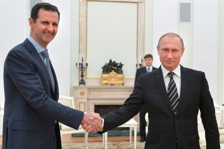 Russian President Vladimir Putin and Syrian President Bashar Assad meet in the Kremlin Tuesday. Assad traveled to Moscow in his first known trip abroad since the war broke out in Syria in 2011. Alexei Druzhinin, RIA-Novosti, Kremlin Pool Photo via AP