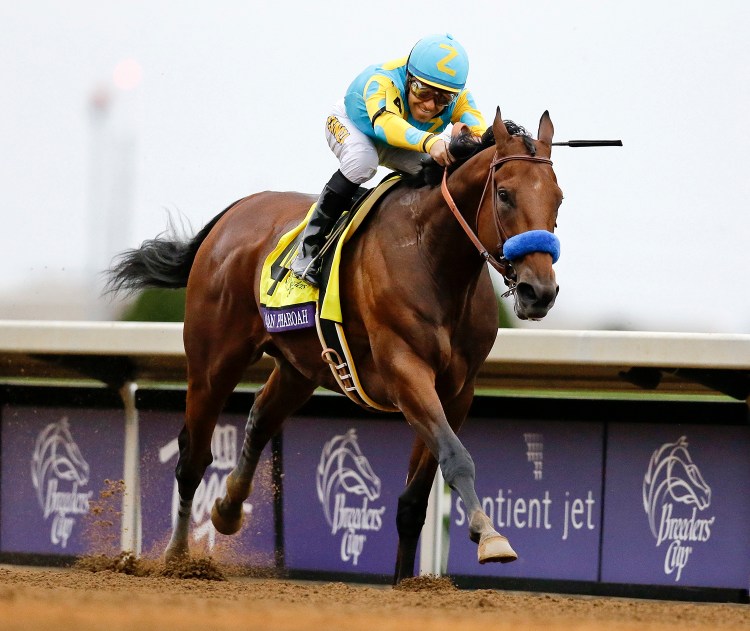 American Pharoah, with Victor Espinoza up, wins the Breeders' Cup Classic at Keeneland race track Saturday in Lexington, Ky. The Associated Press