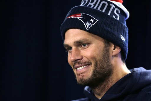 Patriots quarterback Tom Brady listens to a reporter's question during a news conference before Wednesday's practice in Foxborough, Mass. The Associated Press