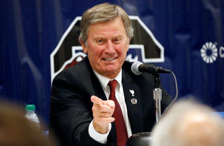 In this Dec. 26, 2014 file photo, South Carolina coach Steve Spurrier gestures during a news conference in Shreveport, La.  A person close to the situation says Spurrier told his team on Monday, Oct. 12, 2015, that he was retiring, effective immediately. The Associated Press