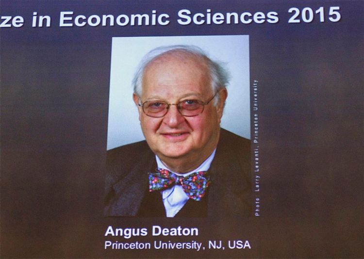 Angus Deaton's photo is projected on a screen at the Royal Swedish Academy of Sciences.
The Associated Press