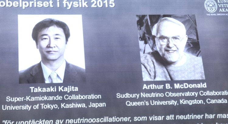 The winners of the Nobel prize in physics are projected on a screen at the Nobel Assembly on Tuesday. The Royal Swedish Academy of Sciences says Takaaki Kajita of Japan and Arthur McDonald won the prize  for their discovery of neutrino oscillations. The Associated Press