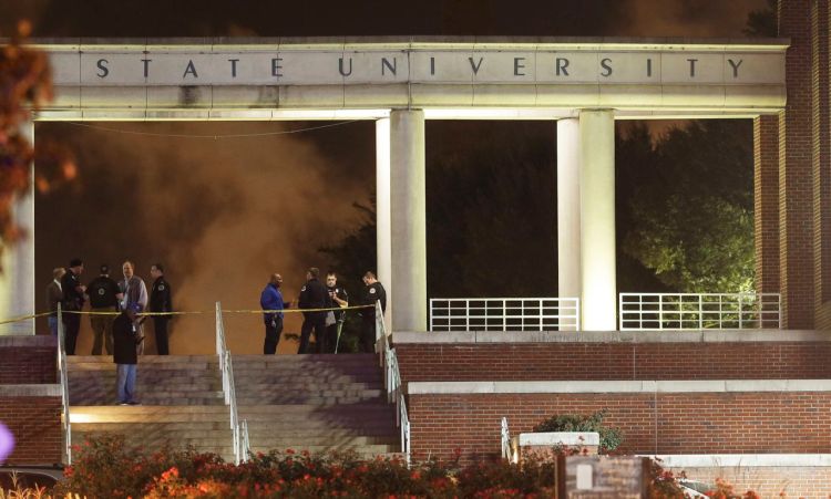 Officials investigate the scene of a shooting on the campus of Tennessee State University, early Friday in Nashville, Tenn. The Associated Press
