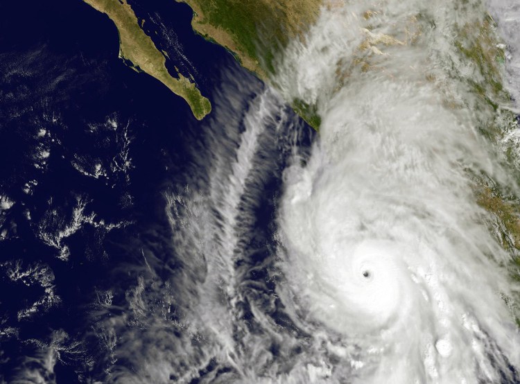 This satellite image taken at 1:45 p.m. EDT on Friday shows the eastern quadrant and pinhole eye of Hurricane Patricia moving toward southwestern Mexico. The Category 5 storm is strongest ever recorded in the Western Hemisphere, according to forecasters.  