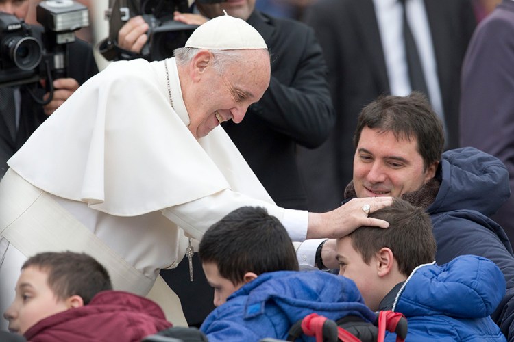 Pope Francis blesses sick children during his weekly general audience, in St. Peter's Square, at the Vatican Wednesday. A Vatican spokesman says the pope's head is "absolutely perfect."  The Associated Press