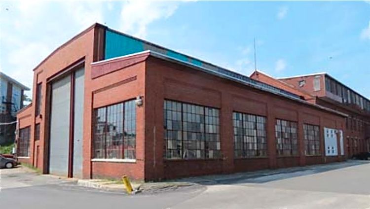 Building 1, known as the  at the Erecting Shop, was built in 1918 to replace an earlier wooden building, according to a 2014 consultant's report. Photo from Sutherland Conservation and Consulting's report titled "The Portland Co. Historic Significance and Integrity."
