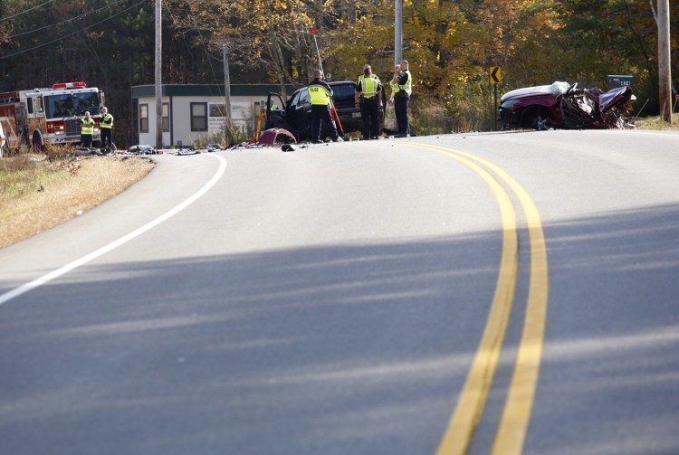 A police detectives work at the scene of a fatal motor vehicle accident on Buxton Road in Saco on Wednesday. Derek Davis/ Staff Photographer