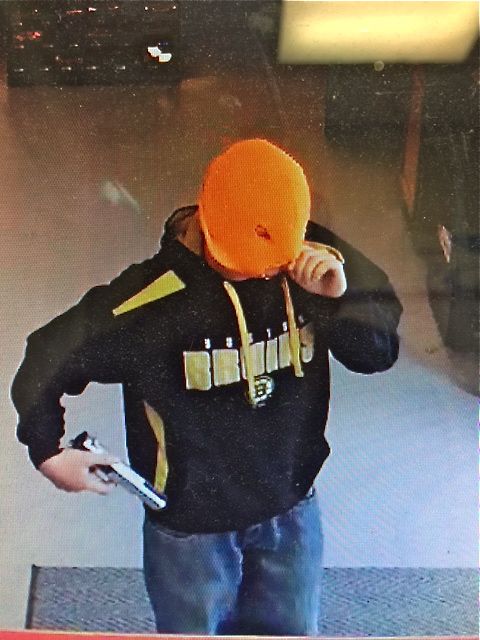 The suspect in the robbery of a convenience store in Sanford was wearing jeans, a Boston Bruins sweatshirt and a bright orange knit cap. Photo courtesy of Sanford Police Department 