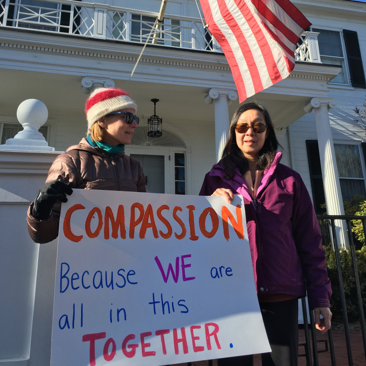 Juliet Shagoury of Hallowell, left, and Sammee Quong, of Augusta, but originally from China, expressed their support for Syrian refugees Wednesday in front of the Blaine House.