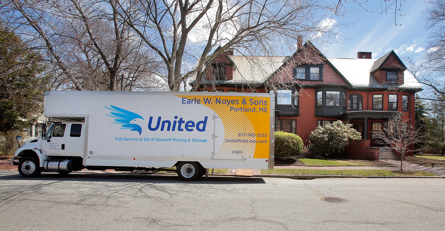 A moving van sits outside a West End home on Vaughn Street in Portland where Ivy McGrew found an apartment