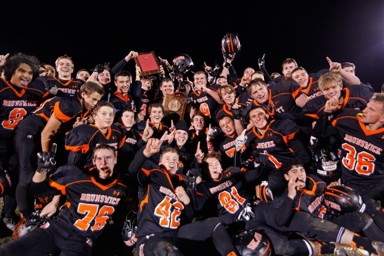 The Dragons celebrates their win over the Witches in the Class B North final.  Jill Brady/Staff Photographer