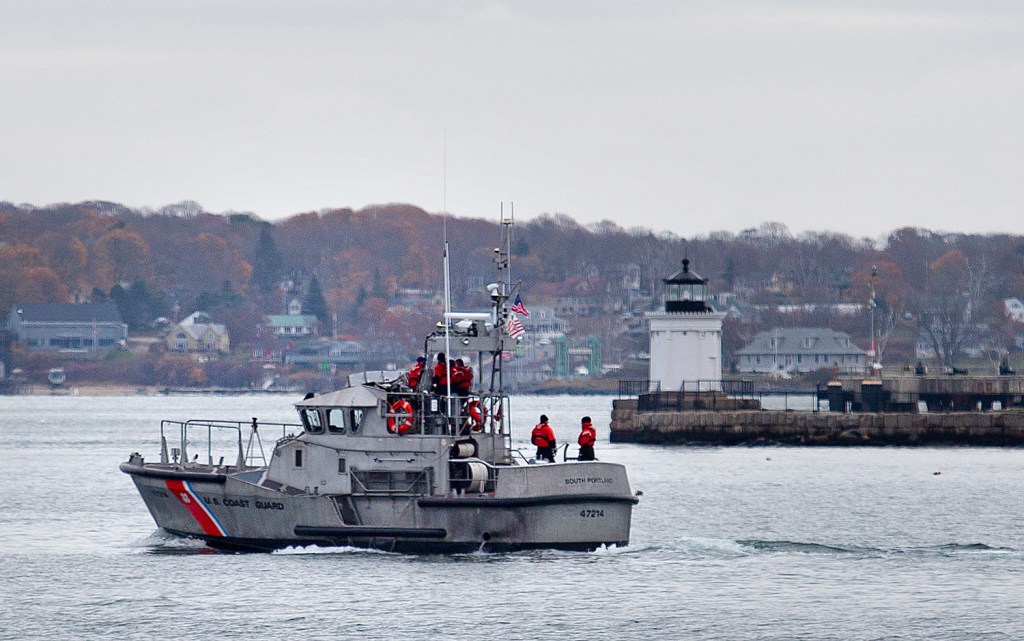 A Coast Guard vessel heads out past Bug Light on Thursday to join the search for a missing water taxi and its operator, Adam Patterson.
Gabe Souza/Staff Photographer