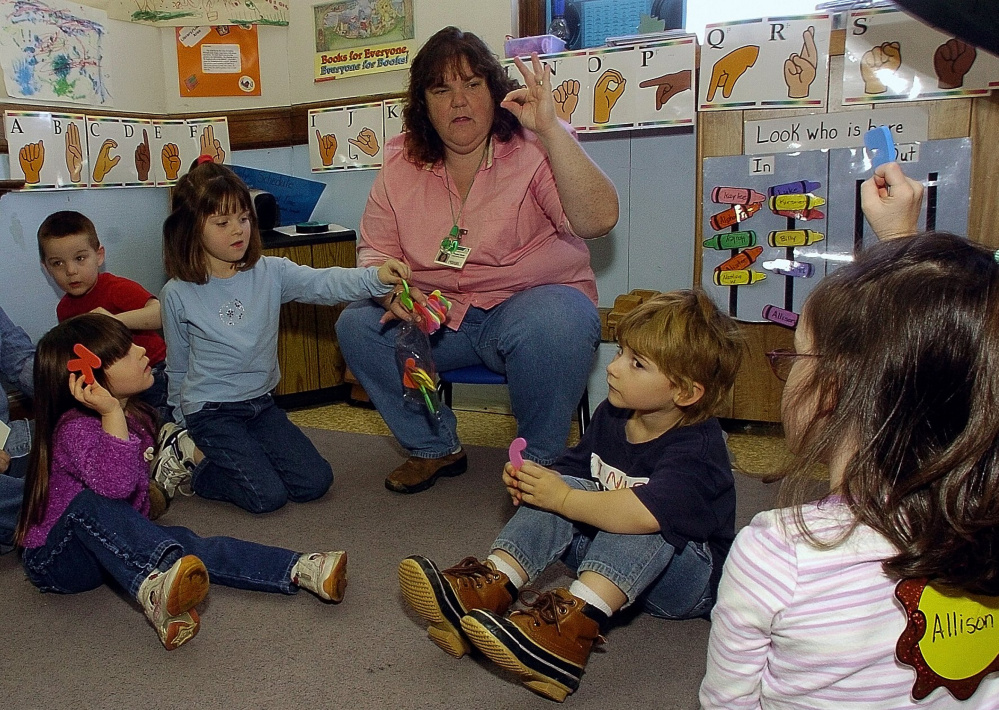 Teacher Theresa Wight instructs preschool students on sign language at Fairfield Primary School on Thursday.
David Leaming/Morning Sentinel