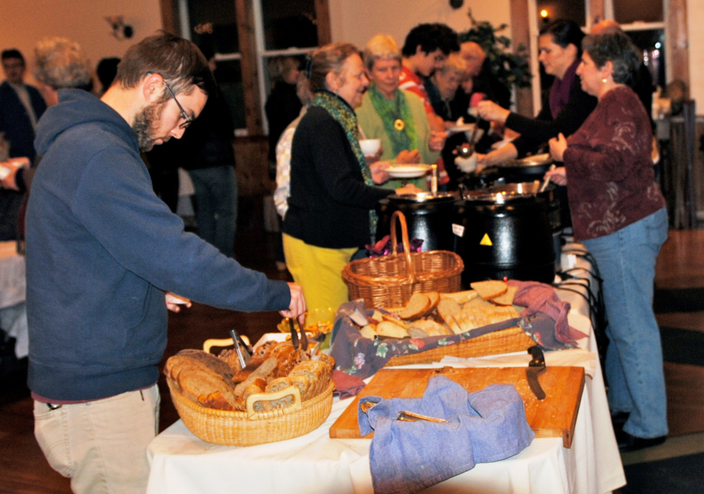 Diners fill their bowls with a variety of soups, stews, chili and chowder and grab some bread for dipping during the 2014 Soup Supper at The Lodge Restaurant in South Berwick.