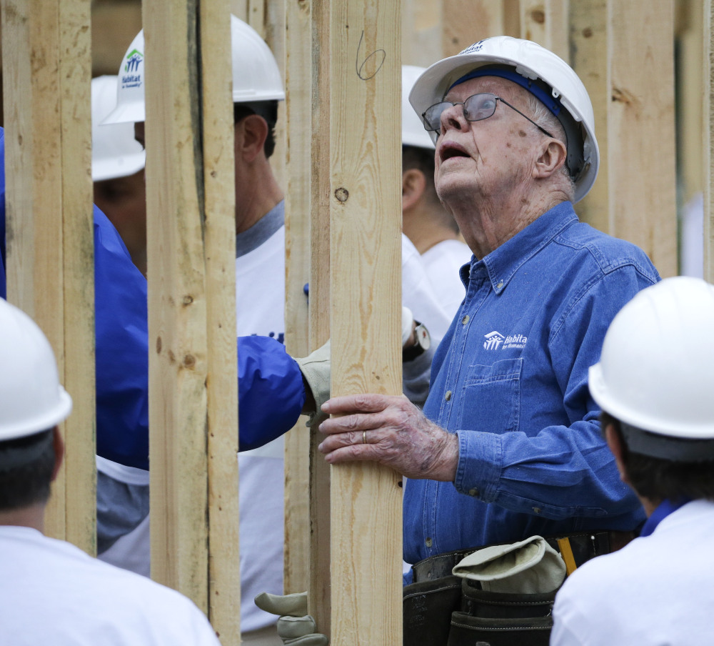 Jimmy Carter works on a Habitat for Humanity building site in Memphis, Tenn., on Monday.