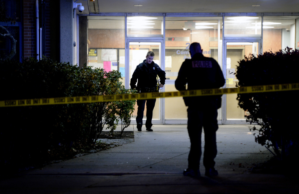 PORTLAND, ME - NOVEMBER 2: With crime scene tape blocking an entrance to Franklin Towers, Portland police investigate an apparent stabbing Monday night November 2, 2015. (Photo by Shawn Patrick Ouellette/Staff Photographer)