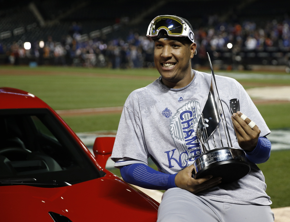 Royals catcher Salvador Perez poses with his trophy after being named the MVP after Game 5 of the World Series on Monday. 