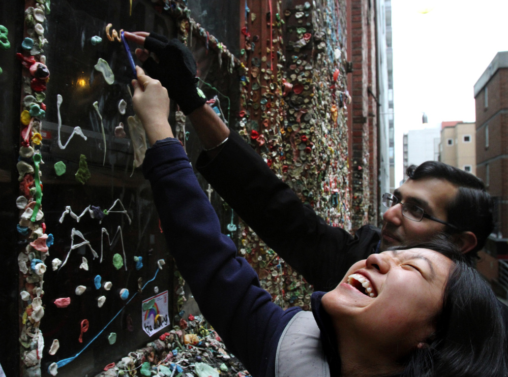 People have been sticking gum to a wall at Seattle’s Pike Place Market for 20 years, but a cleaning crew expects to clean up the mess in three or four days.