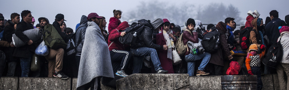 Migrants wait in Slovenia to gain entrance to Austria. Officials in Austria say that if Germany closes its borders, Austria may be forced to do so, too.